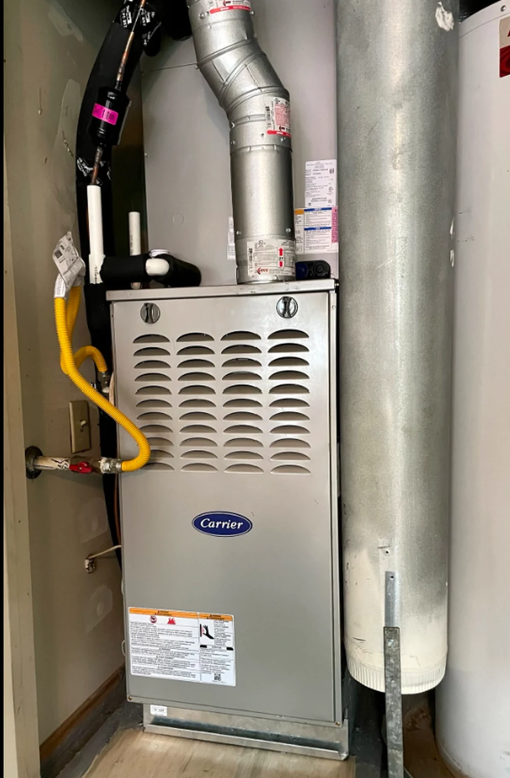 Carrier furnace installed and piped in a utility closet