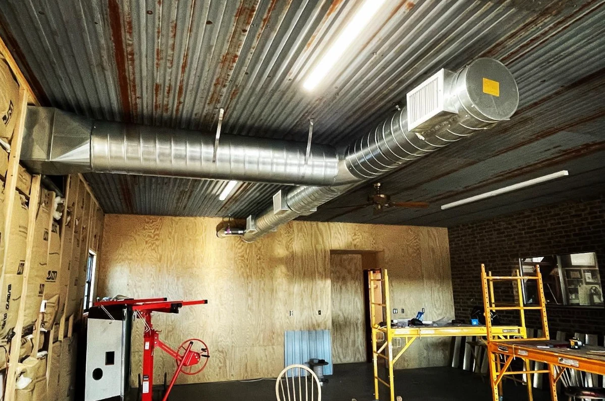 Spiral duct run installed by Creative Comfort Solutions in a Central Texas commercial build-out